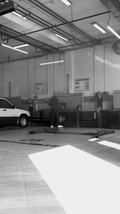 Mechanic at work in sunlit workshop